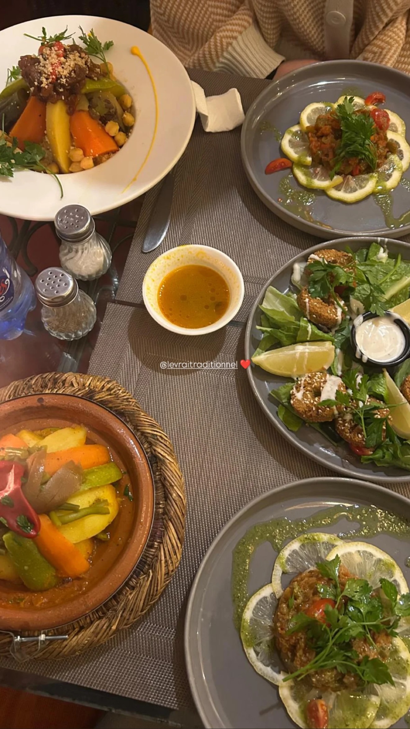 Travellers tasting tanjia in the kitchen of Le Vrai Traditionnel, Bab Doukkala, Marrakech